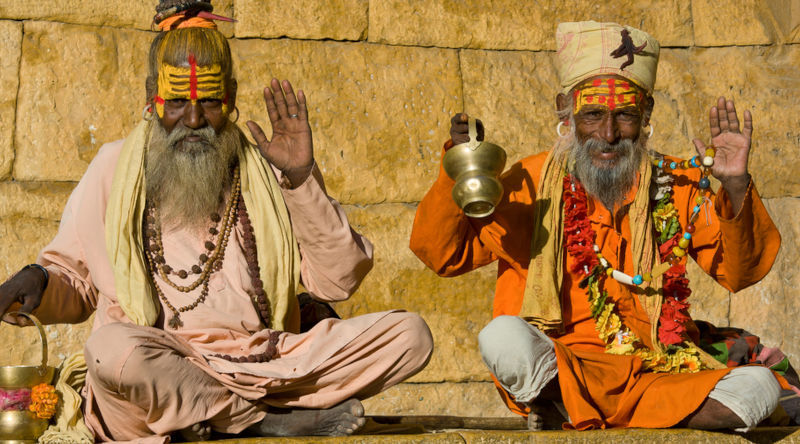 Indian sadhu greeting a tourist